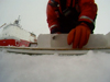 Graduate student Jessica Cross cuts an ice core.