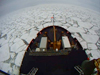 The Healy's bow pushes ice along the edge.